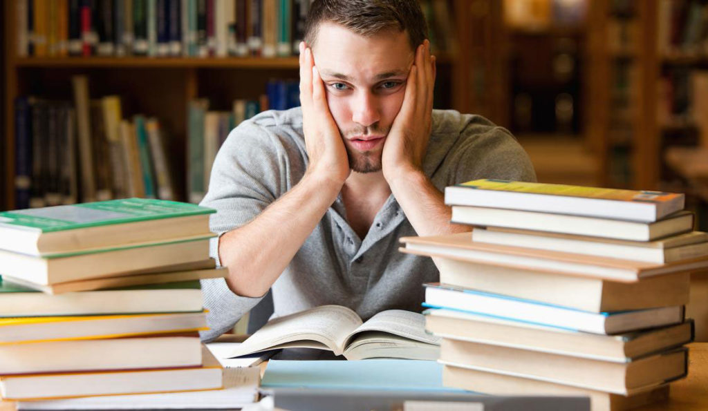 Tired student in library
