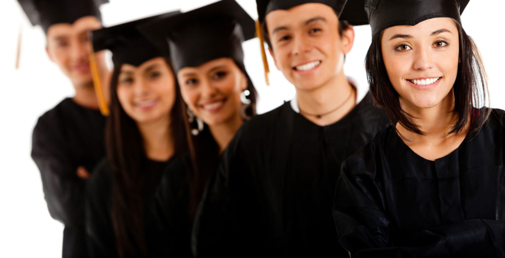 five people wearing graduation cap and gown