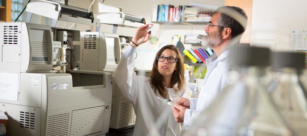 Student in a lab with professor