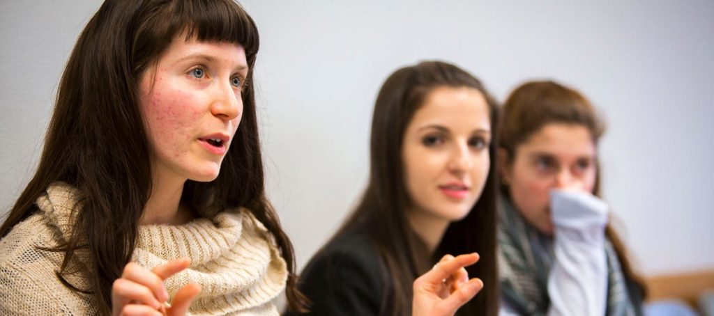 Student talking and using her hands
