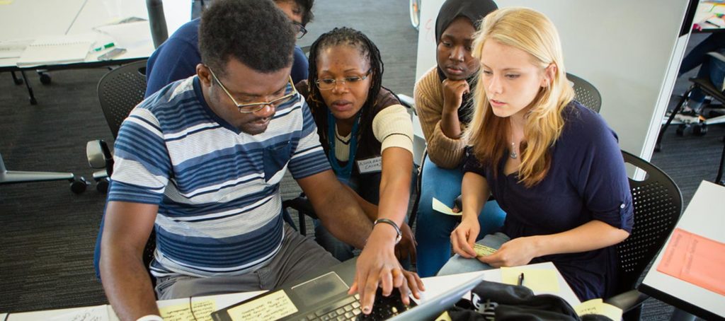 Students working with an advisor