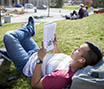 Student reading outside