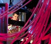Student looking through computer wires