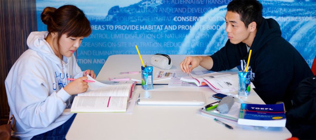 Students studying at a Greiner work station
